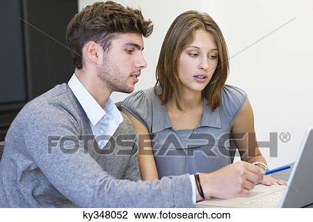 University students using laptop in classroom View Large Photo Image Stock Image - University students using laptop in classroom. Fotosearch