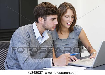 University students using laptop in classroom View Large Photo Image Stock Photo - University students using laptop in classroom. Fotosearch