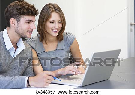 University students using laptop in classroom View Large Photo Image Stock Photo - University students using laptop in classroom. Fotosearch