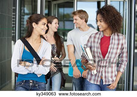 Stock Image - Cheerful friends in campus. Fotosearch