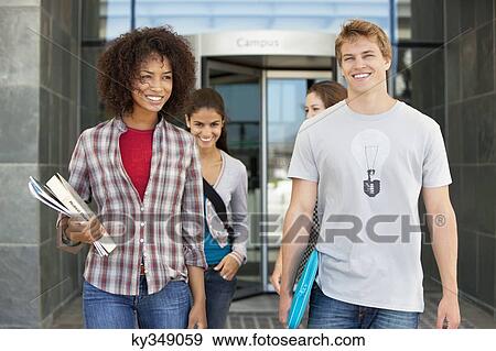 Cheerful friends in campus View Large Photo Image Stock Photo - Cheerful friends in campus. Fotosearch
