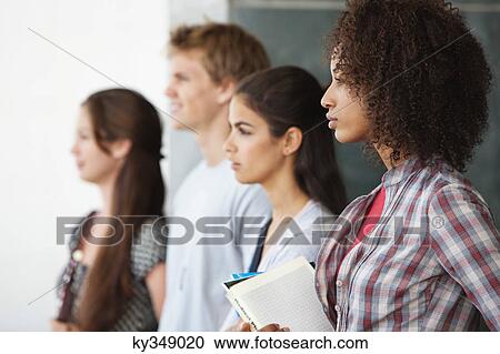 Close-up of university students standing together View Large Photo Image Stock Image - Close-up of university students standing together. Fotosearch