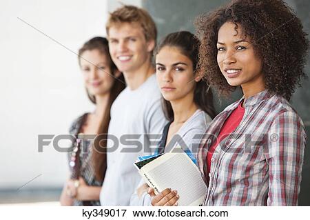 Close-up of university students standing together View Large Photo Image Stock Photo - Close-up of university students standing together. Fotosearch