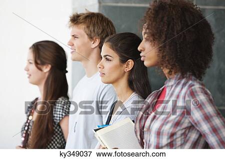 Close-up of university students standing together View Large Photo Image Stock Photo - Close-up of university students standing together. Fotosearch