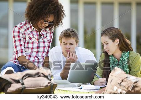 Friends studying in a campus View Large Photo Image Stock Image - Friends studying in a campus. Fotosearch