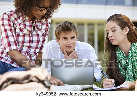 Friends studying in a campus View Large Photo Image Stock Image - Friends studying in a campus. Fotosearch