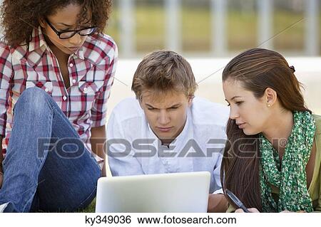 Stock Photograph - Friends studying in a campus. Fotosearch