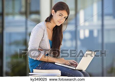 Portrait of a woman using a laptop View Large Photo Image Stock Photography - Portrait of a woman using a laptop. Fotosearch