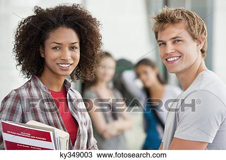 Portrait of two university students smiling View Large Photo Image Stock Image - Portrait of two university students smiling. Fotosearch