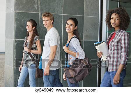 Portrait of university students standing in campus View Large Photo Image Stock Photo - Portrait of university students standing in campus. Fotosearch