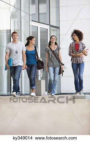 University students walking in a campus View Large Photo Image Picture - University students walking in a campus. Fotosearch