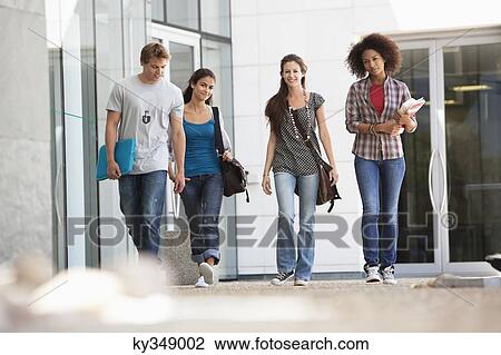 University students walking in a campus View Large Photo Image Stock Image - University students walking in a campus. Fotosearch