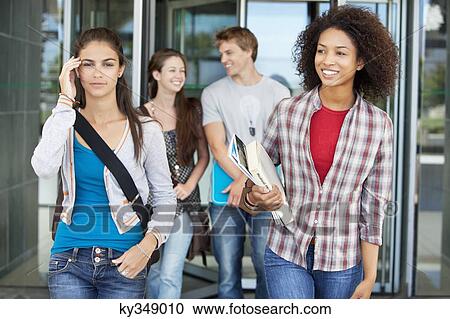 University students walking in a campus View Large Photo Image Stock Image - University students walking in a campus. Fotosearch
