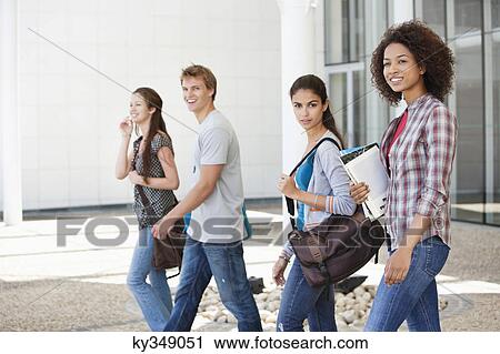 University students walking in a campus View Large Photo Image Stock Image - University students walking in a campus. Fotosearch