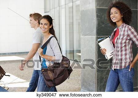Stock Photo - University students walking in a campus. Fotosearch