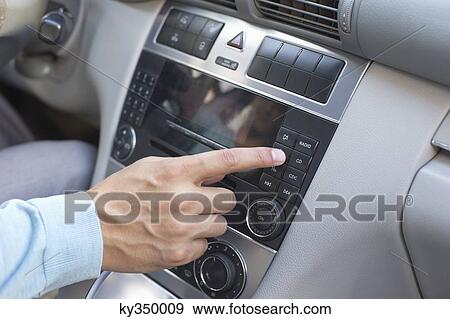 Man playing the music in car View Large Photo Image Stock Photo - Man playing the music in car. Fotosearch