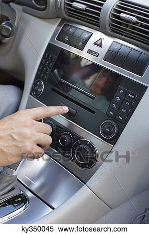 Man playing the music in car View Large Photo Image Stock Photography - Man playing the music in car. Fotosearch