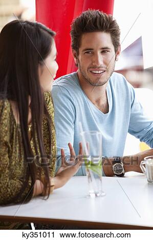 Couple having discussion in a restaurant View Large Photo Image Stock Image - Couple having discussion in a restaurant. Fotosearch
