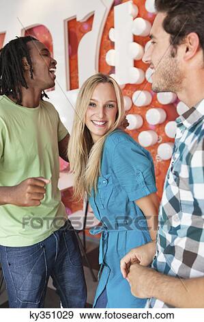 Friends enjoying in a bar View Large Photo Image Stock Photo - Friends enjoying in a bar. Fotosearch