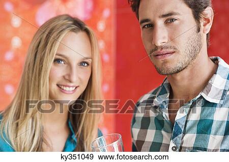 Stock Photo - Portrait of friends at a bar. Fotosearch