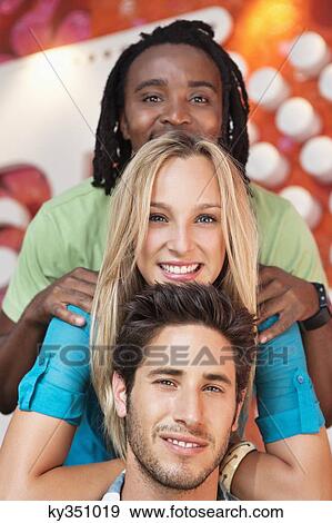 Portrait of friends enjoying in a bar View Large Photo Image Stock Photo - Portrait of friends enjoying in a bar. Fotosearch