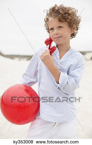 Boy holding ball View Large Photo Image Stock Photo - Boy holding ball. Fotosearch