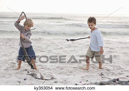 Boys playing on the beach View Large Photo Image Picture - Boys playing on the beach. Fotosearch