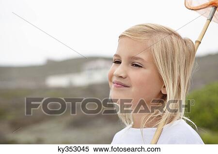 Close-up of a girl smiling View Large Photo Image Stock Photography - Close-up of a girl smiling. Fotosearch
