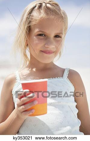 Portrait of a girl holding glass View Large Photo Image Stock Image - Portrait of a girl holding glass. Fotosearch