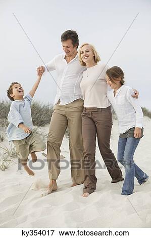 Family enjoying on the beach View Large Photo Image Stock Photo - Family enjoying on the beach. Fotosearch