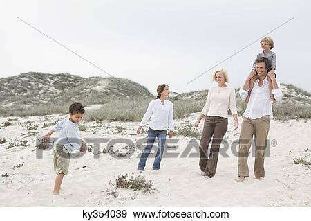 Family enjoying on the beach View Large Photo Image Stock Photo - Family enjoying on the beach. Fotosearch