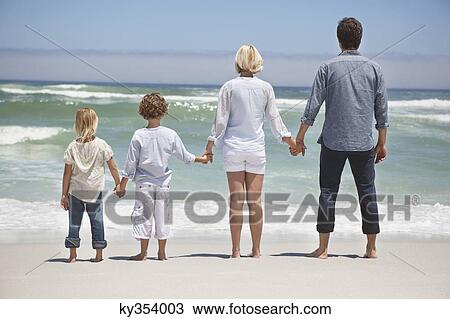 Family looking at sea view from beach View Large Photo Image Stock Image - Family looking at sea view from beach. Fotosearch