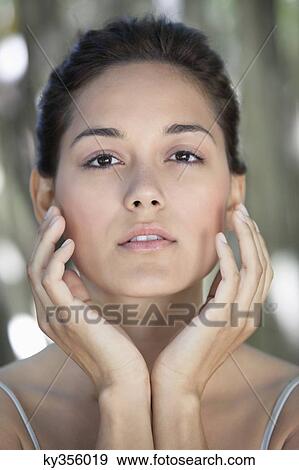 Stock Photo - Portrait of a beautiful young woman. Fotosearch