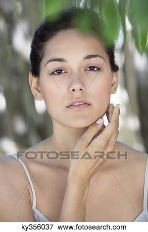 Portrait of a beautiful young woman View Large Photo Image Stock Photo - Portrait of a beautiful young woman. Fotosearch