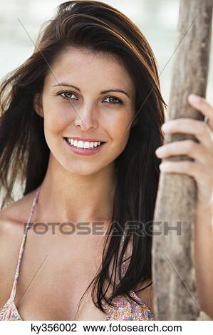 Stock Image - Portrait of a woman smiling. Fotosearch
