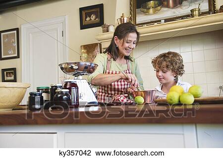 Grandmother and little boy cooking food at kitchen View Large Photo Image Stock Image - Grandmother and little boy cooking food at kitchen. Fotosearch