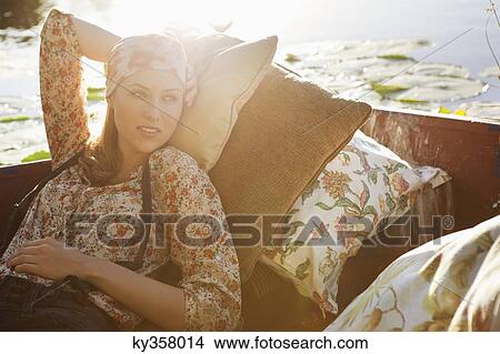 Beautiful woman day dreaming in the boat View Large Photo Image Picture - Beautiful woman day dreaming in the boat. Fotosearch