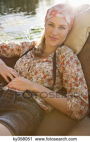 Beautiful woman resting in the boat View Large Photo Image Stock Image - Beautiful woman resting in the boat. Fotosearch