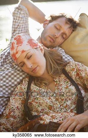 Young couple sleeping in the boat View Large Photo Image Stock Photography - Young couple sleeping in the boat. Fotosearch