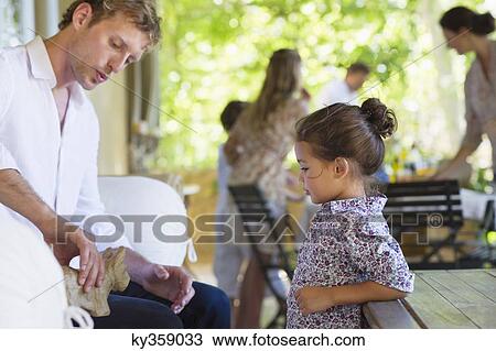 Stock Image - Family preparing for food at house. Fotosearch