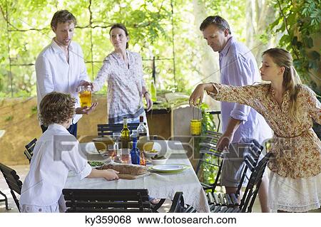 Family preparing for food at house View Large Photo Image Stock Photo - Family preparing for food at house. Fotosearch