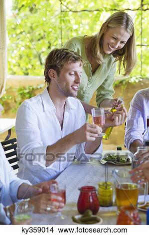 Happy family having drink at home View Large Photo Image Picture - Happy family having drink at home. Fotosearch