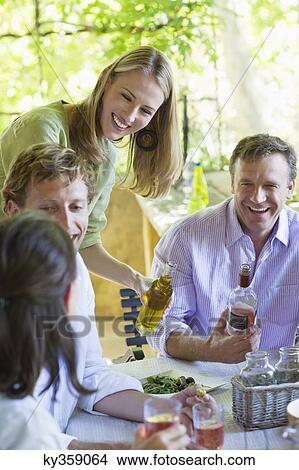 Happy family having drink at home View Large Photo Image Picture - Happy family having drink at home. Fotosearch