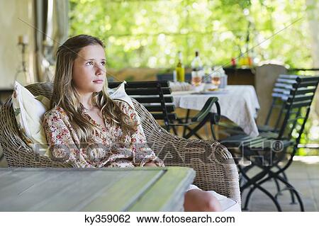 Little girl looking away with food on table in the background View Large Photo Image Stock Image - Little girl looking away with food on table in the background. Fotosearch