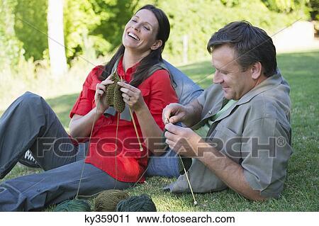 Mature couple knitting together in the garden View Large Photo Image Stock Image - Mature couple knitting together in the garden. Fotosearch
