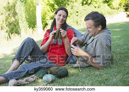 Mature couple knitting together in the garden View Large Photo Image Stock Image - Mature couple knitting together in the garden. Fotosearch