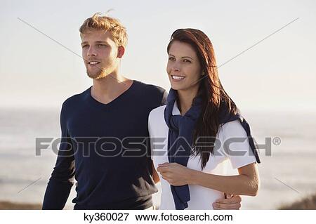 Close-up of a couple smiling View Large Photo Image Stock Photo - Close-up of a couple smiling. Fotosearch