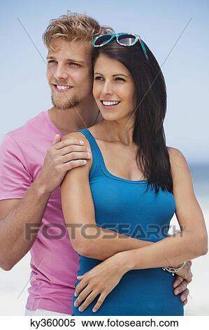 Couple romancing on the beach View Large Photo Image Stock Photography - Couple romancing on the beach. Fotosearch