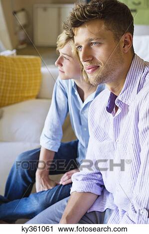 Contemplative man and a little boy looking away at house View Large Photo Image Stock Image - Contemplative man and a little boy looking away at house. Fotosearch