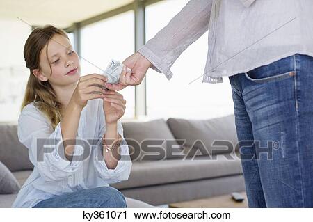 Girl taking money from her mother View Large Photo Image Stock Image - Girl taking money from her mother. Fotosearch